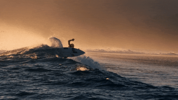 Quiksilver commercial still of surfer hitting the lip of a wave