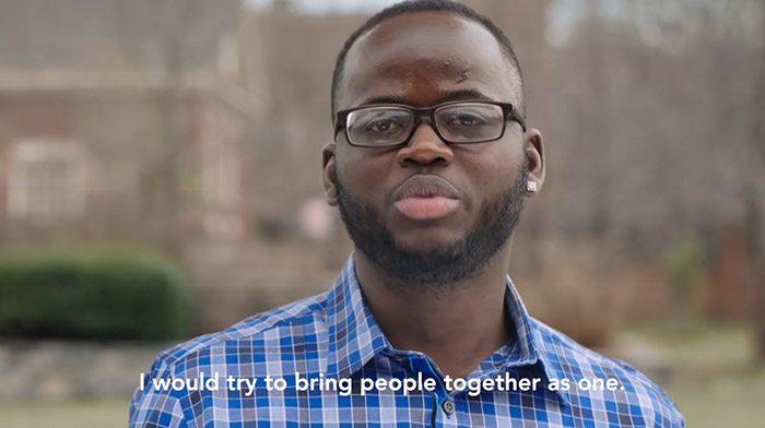 Bloomberg commercial still of a black man talking to camera
