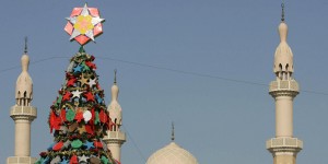 Backdropped by a mosque, ornaments beari