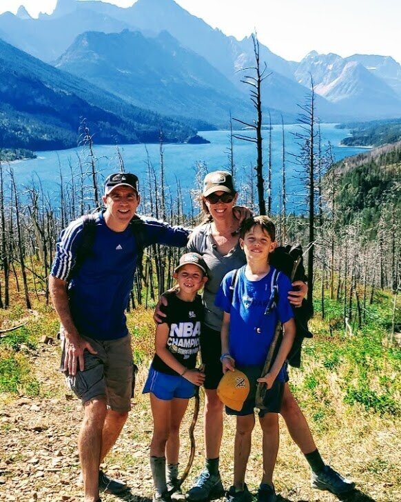 Allison Kelly, with her family, on a hike in Glacier National Park.