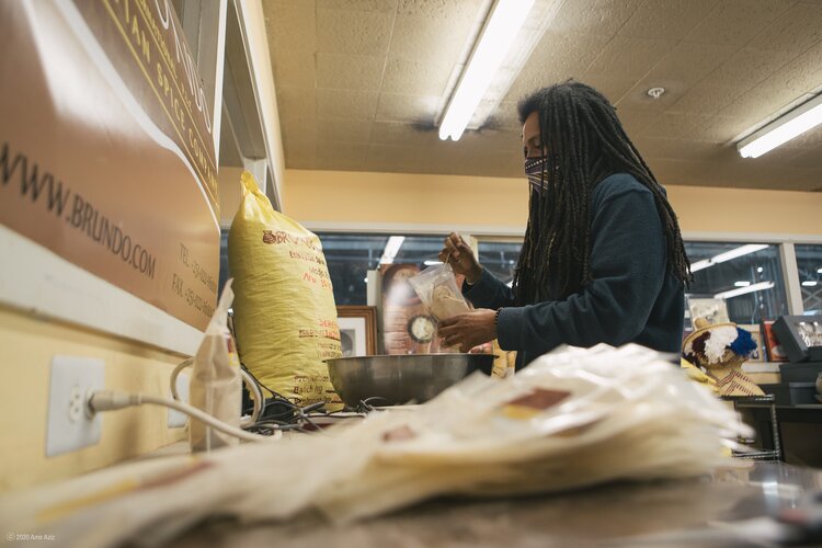 Aderaw working at the Brundo Market store in Oakland, CA