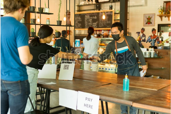 A local business, a cafe, serving its customers, to represent how Spot Parking is empowering local businesses during the pandemic