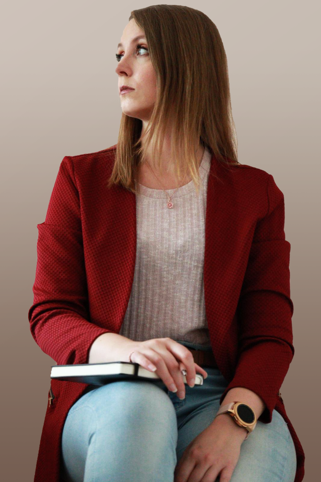 picture of the artist, Jaqueline Martin, with the head turned to the left in a red jacket