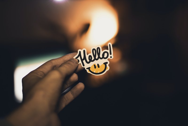 Image of a smiley face saying hello