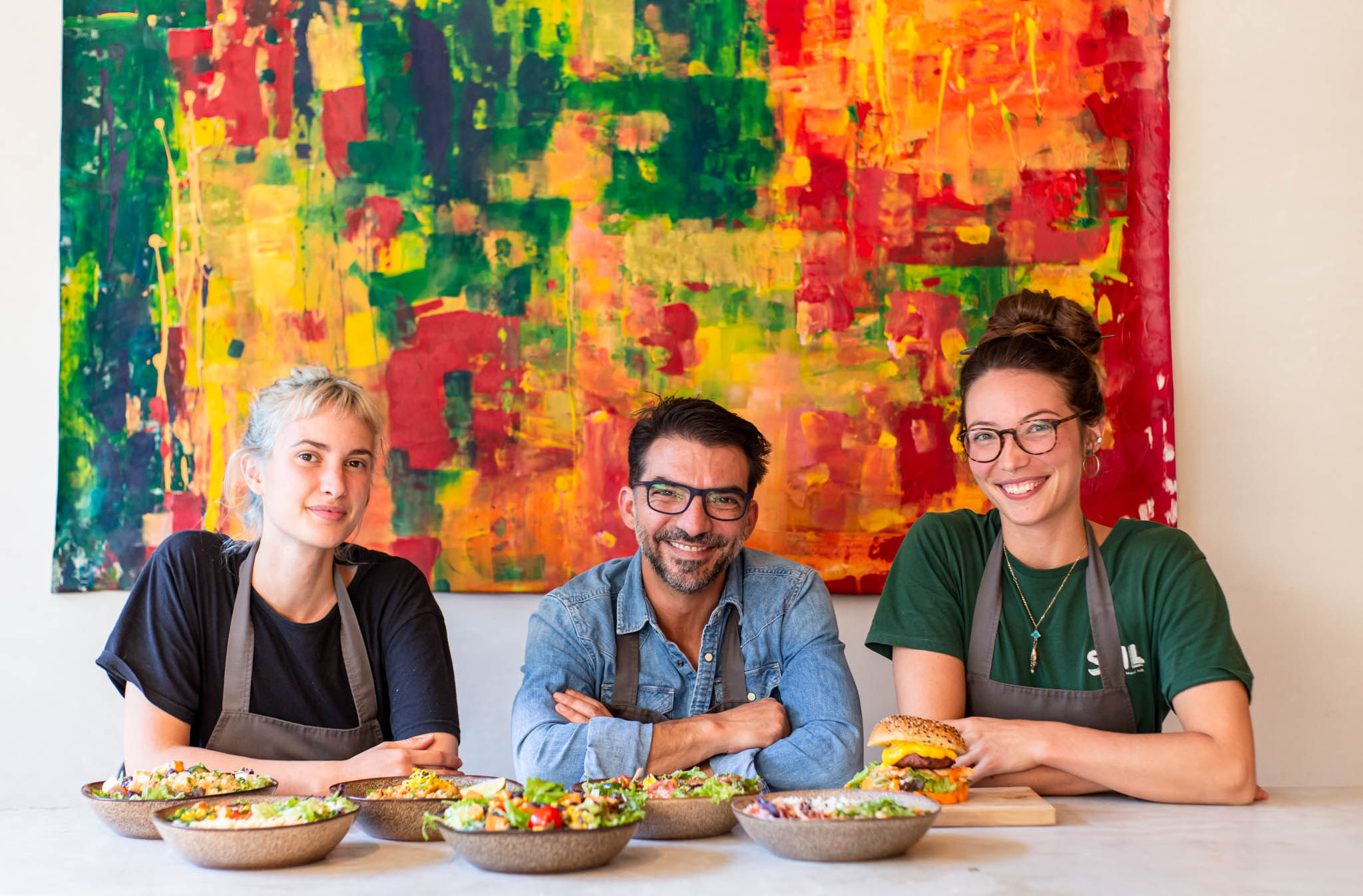Soil's restaurant owner with two staff members