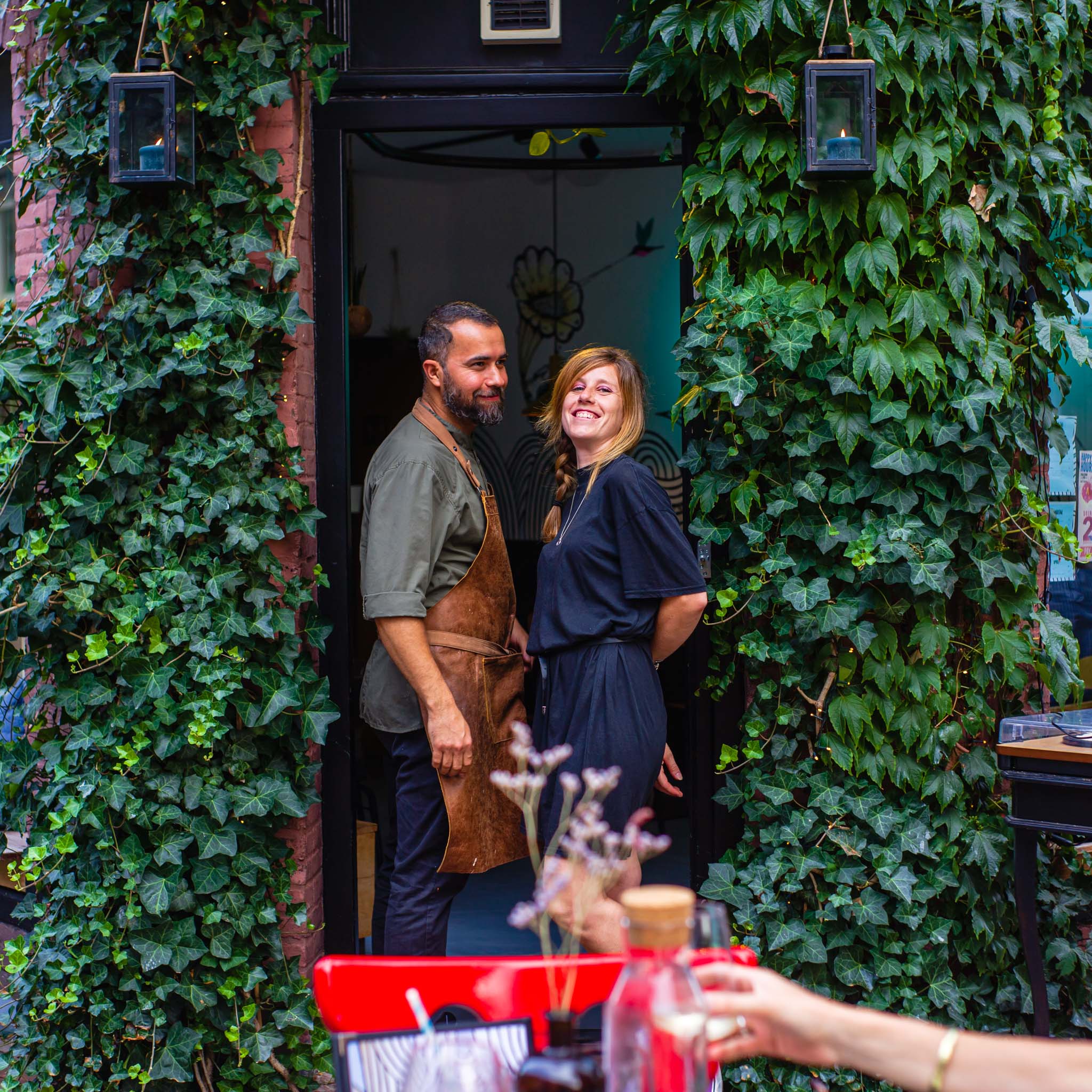 A couple standing at the door in Colibri restaurant in Amsterdam