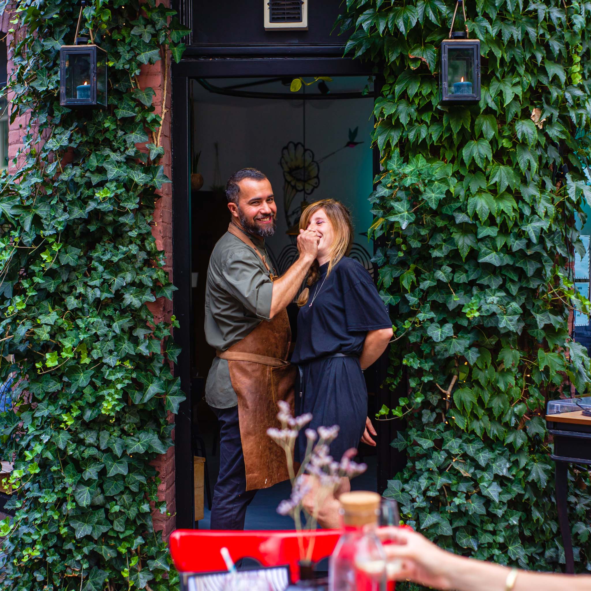 Couple at the door of a restaurant in Amsterdam