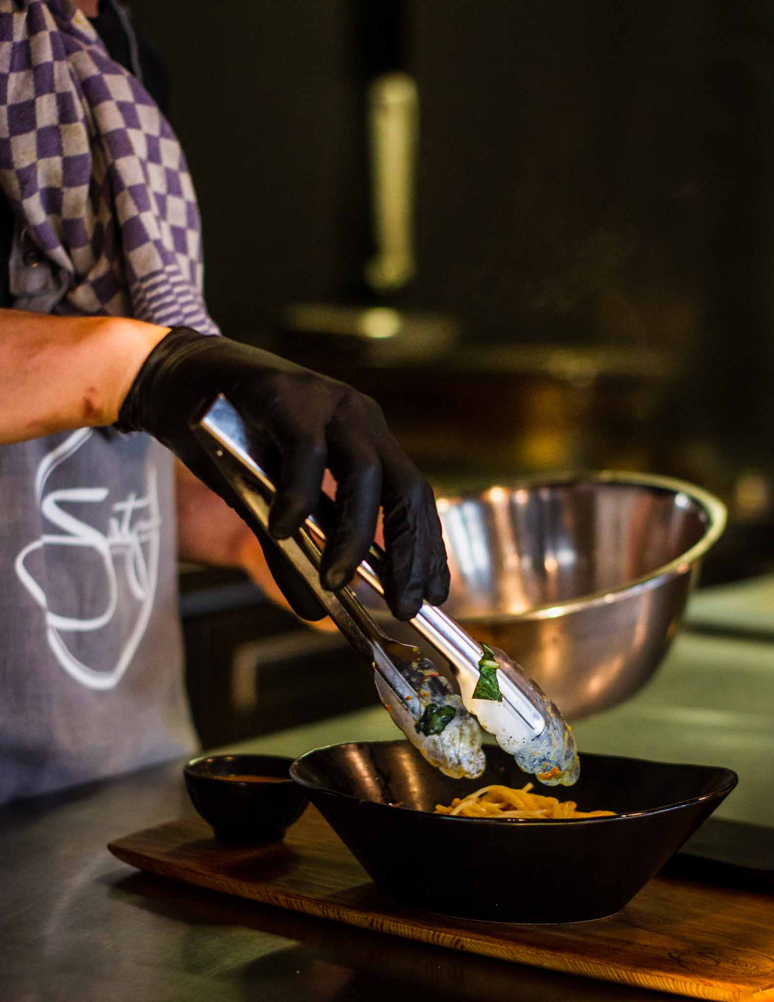 Chef in a Thai restaurant preparing food