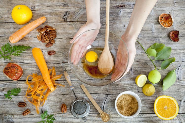 Fresh real food ingredients including lemon orange pecans carrots and egg