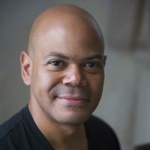Headshot of Charles Rice-González