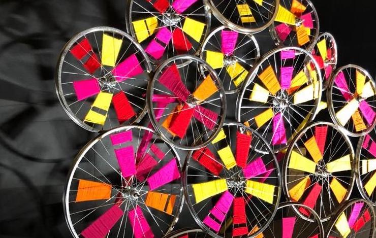 Art Installation using yarn and old cycle wheels by the team at studio rêver