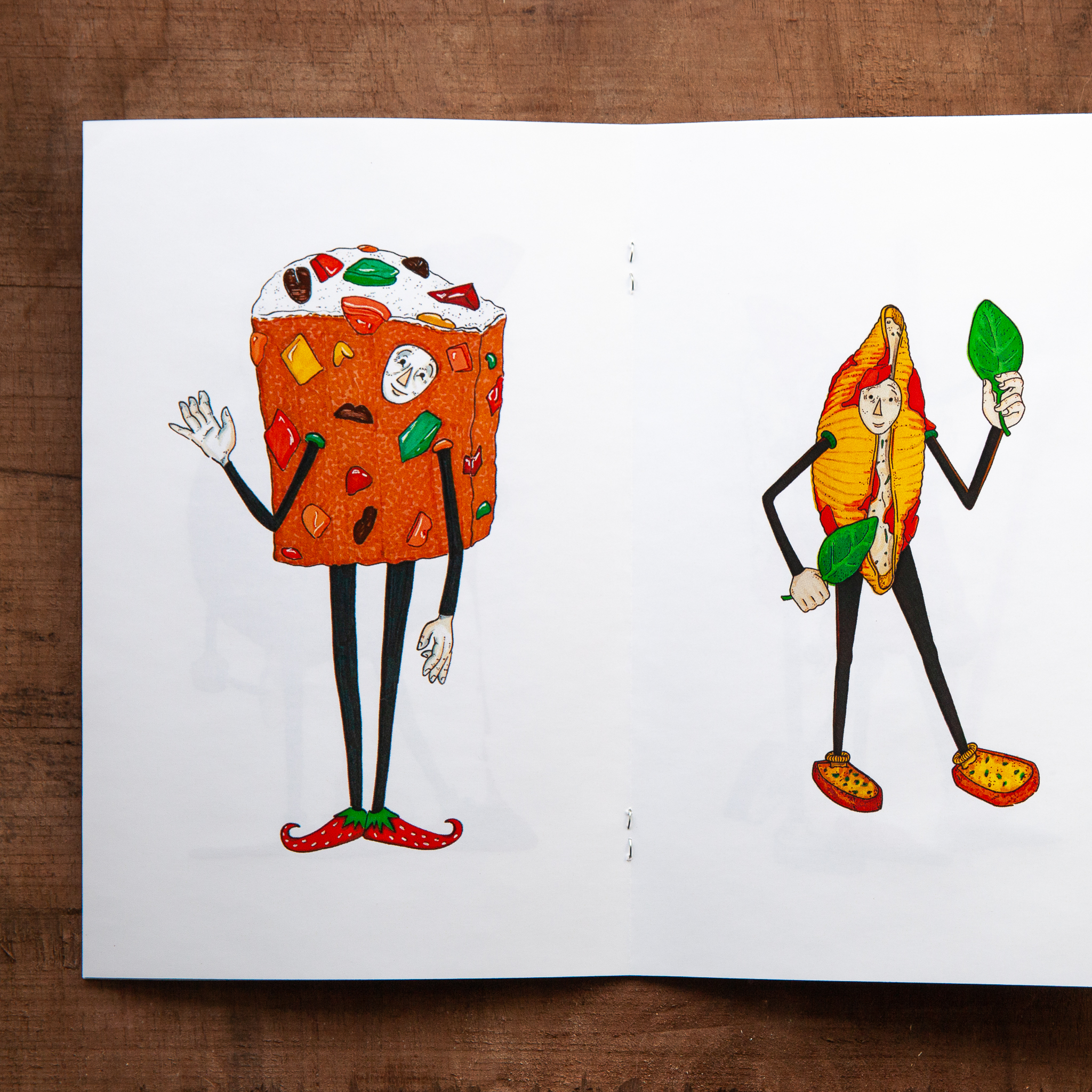 Zine with fruitcake person and stuffed pasta shell person.