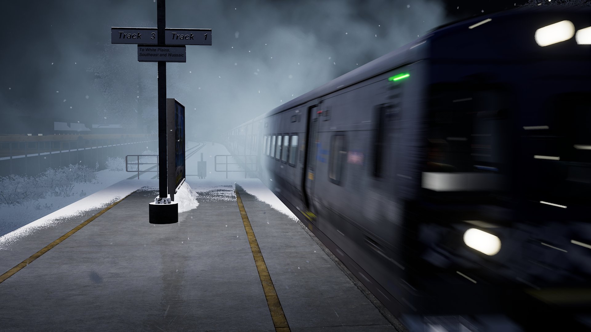 A train rushes through a station at night.
