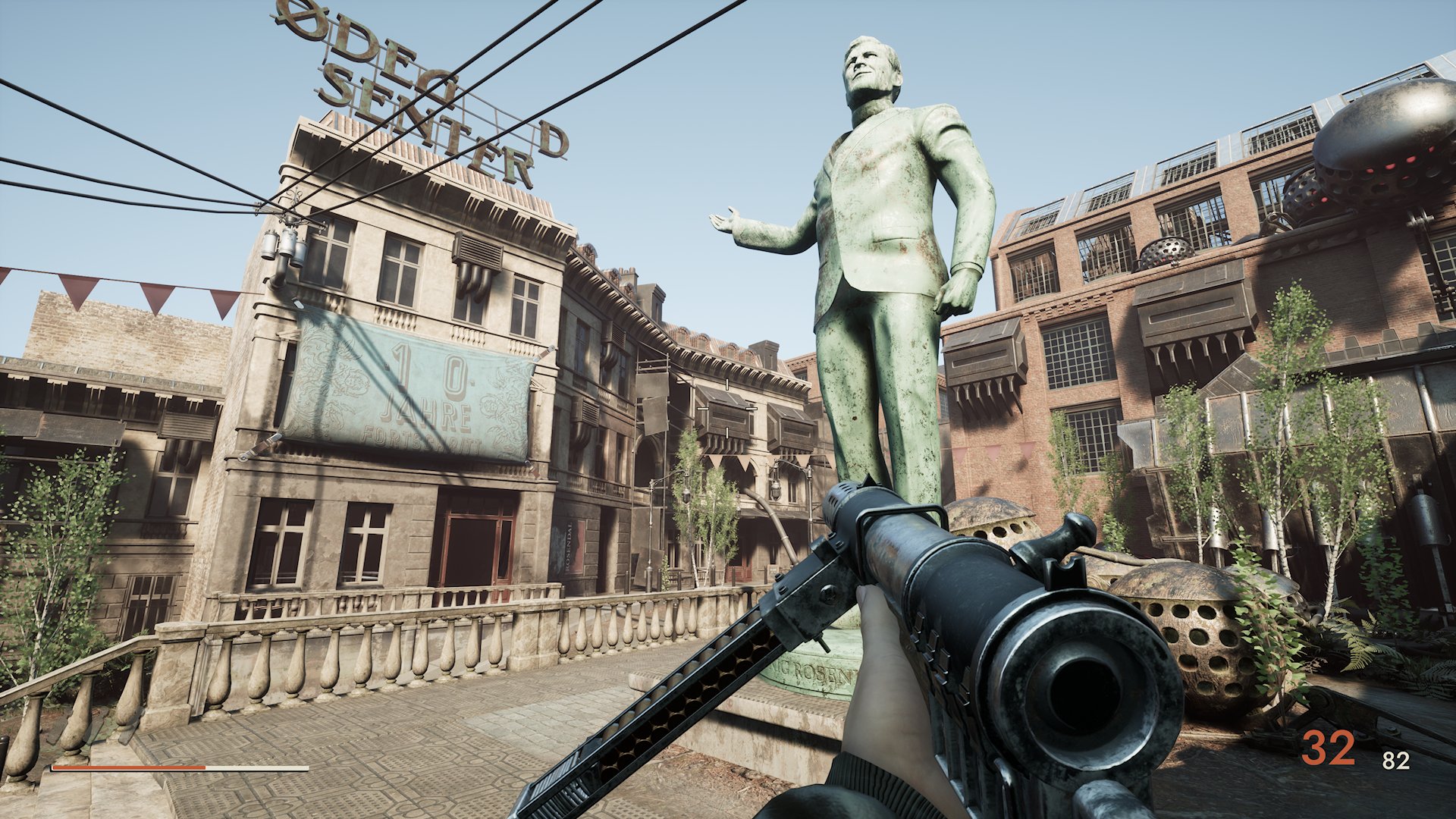 A large statue dominates a city square.