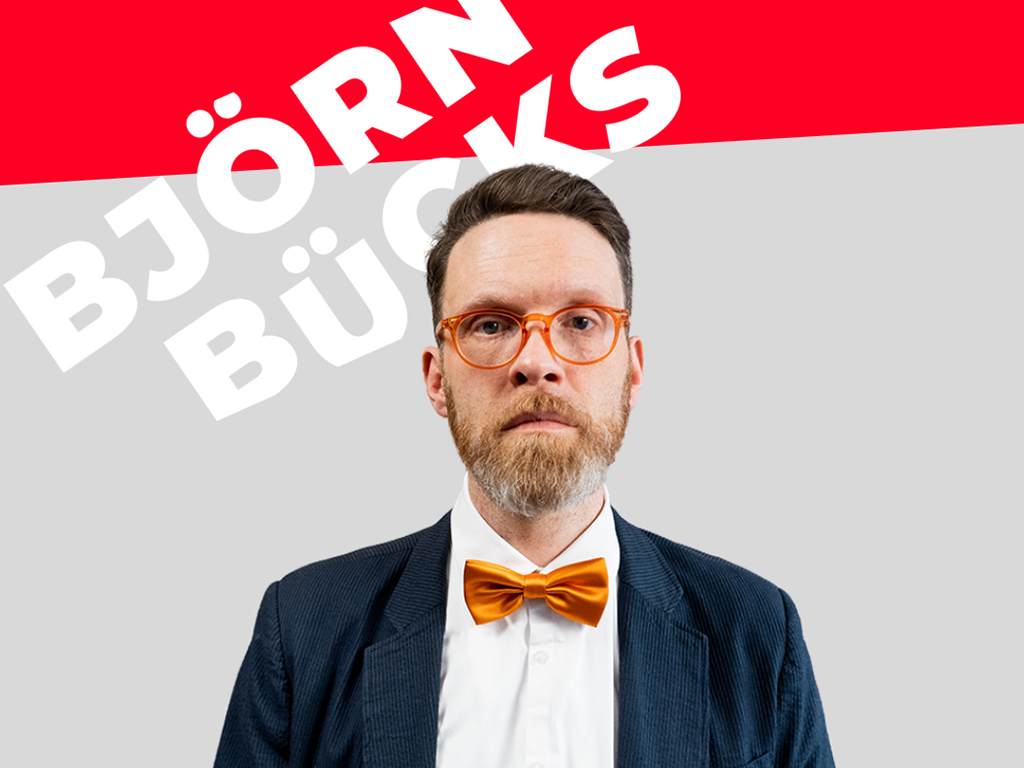 adrettes Portrait von Björn Bücks mit Fliege