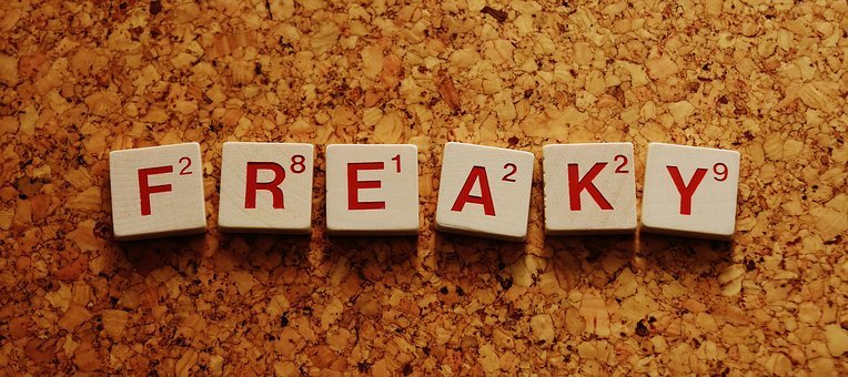 wooden scrabble type letters spelling FREAKY