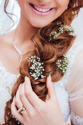 bride with beautiful loopy loose braid.