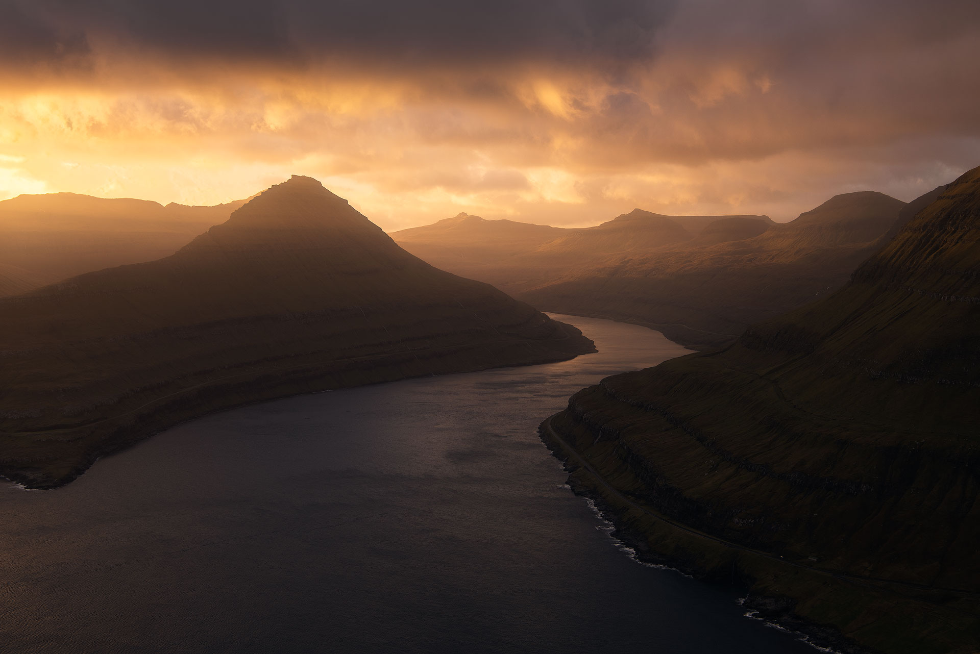 Golden hour over mountains and water