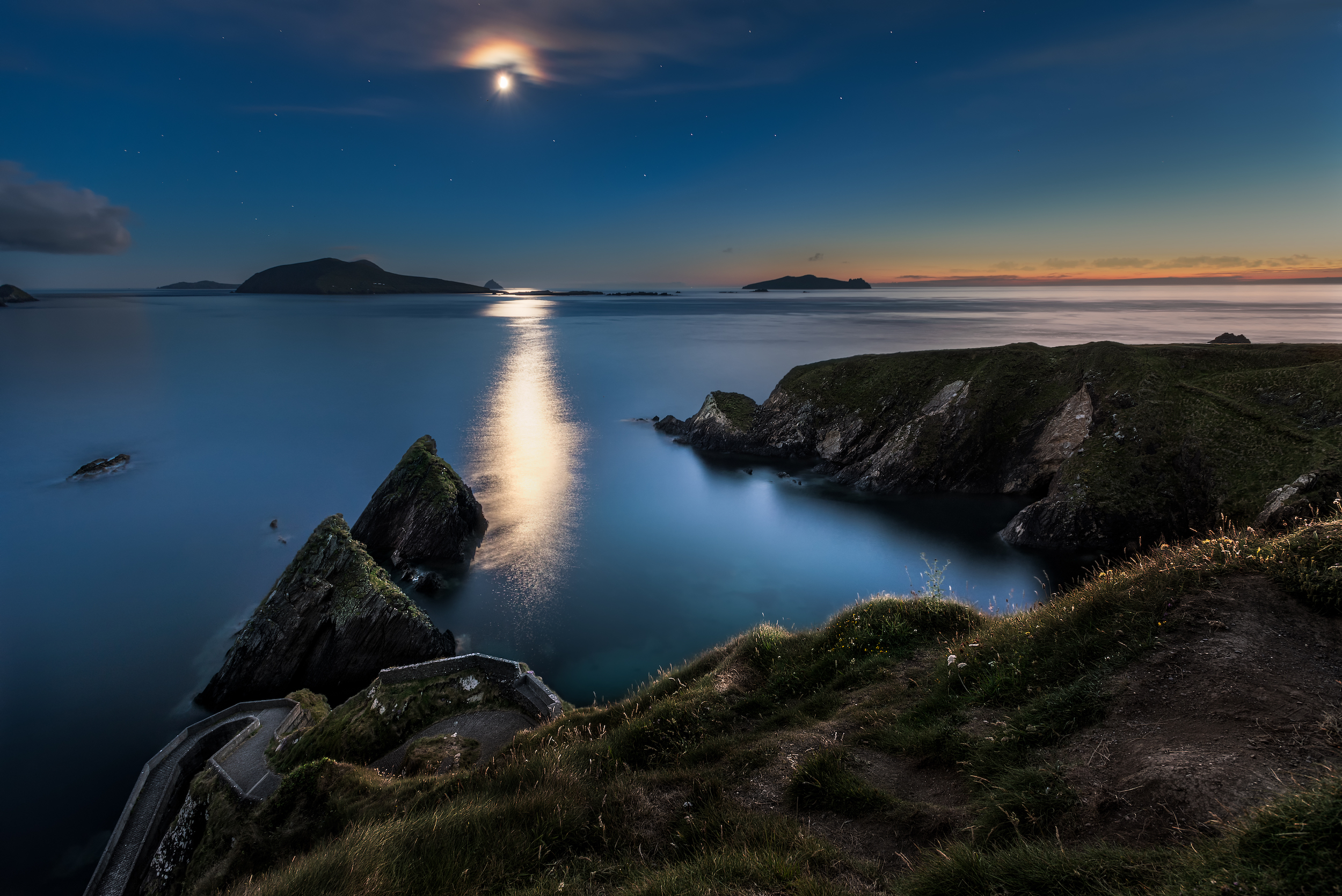 Moonshine at Dunquin Pier, Ireland at midnight in July.