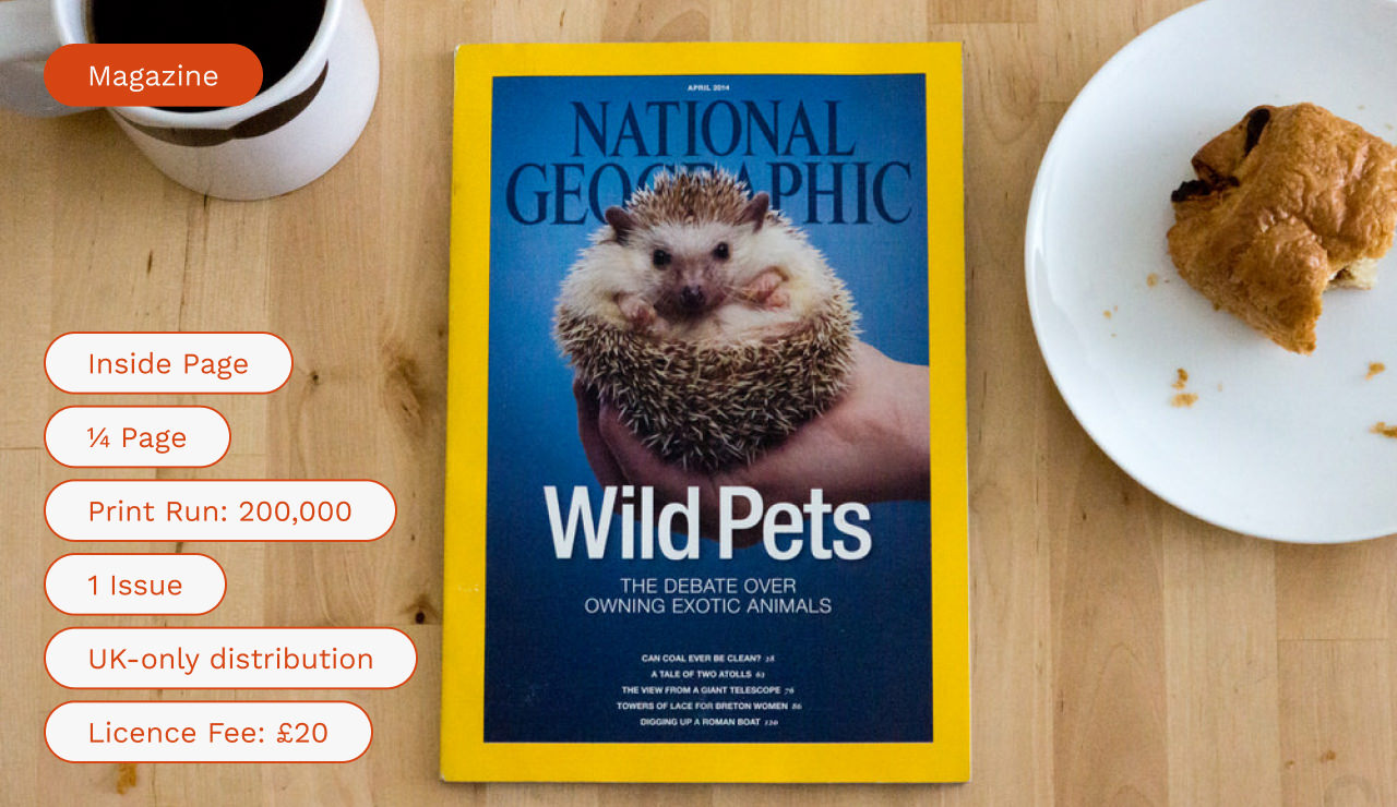 National Geographic magazine on a wooden surface with breakfast items