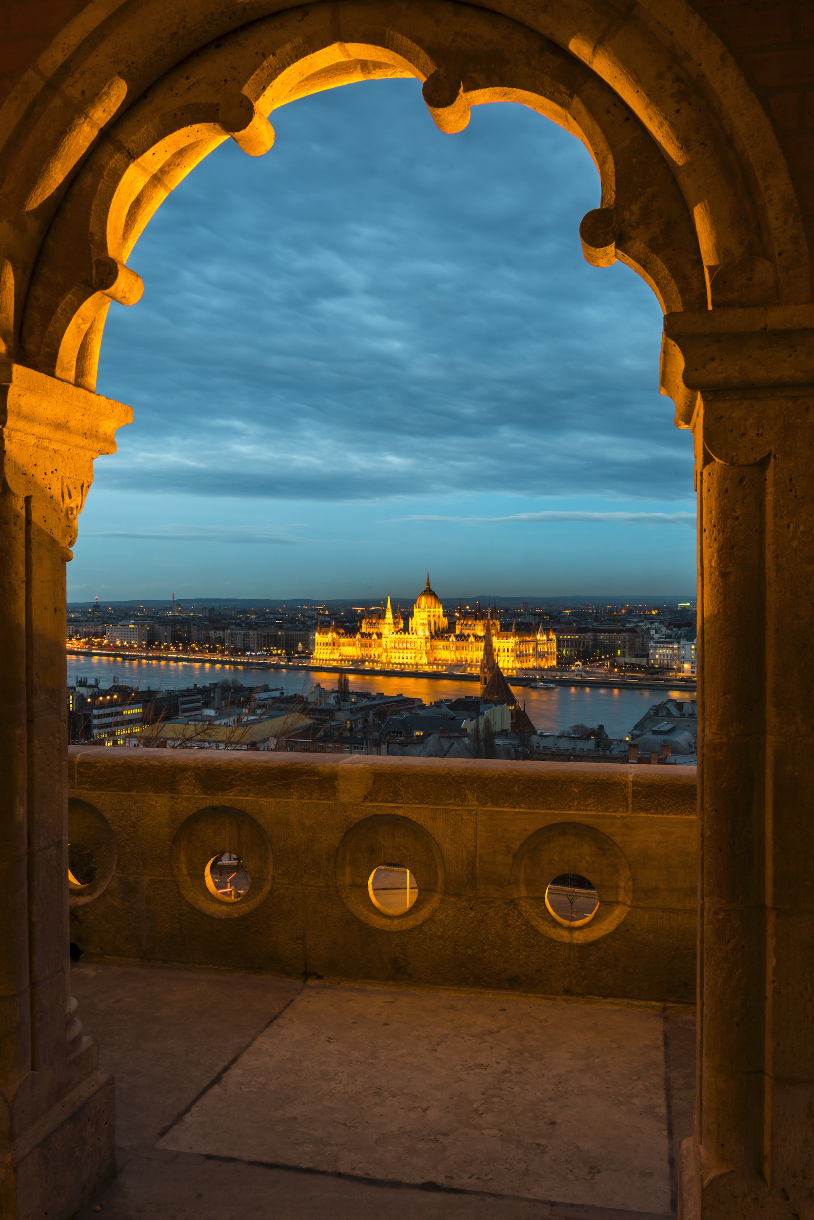 A view of the Hungarian Parliament from fishermens bastion in Budapest just after sunset and at the start of blue hour.