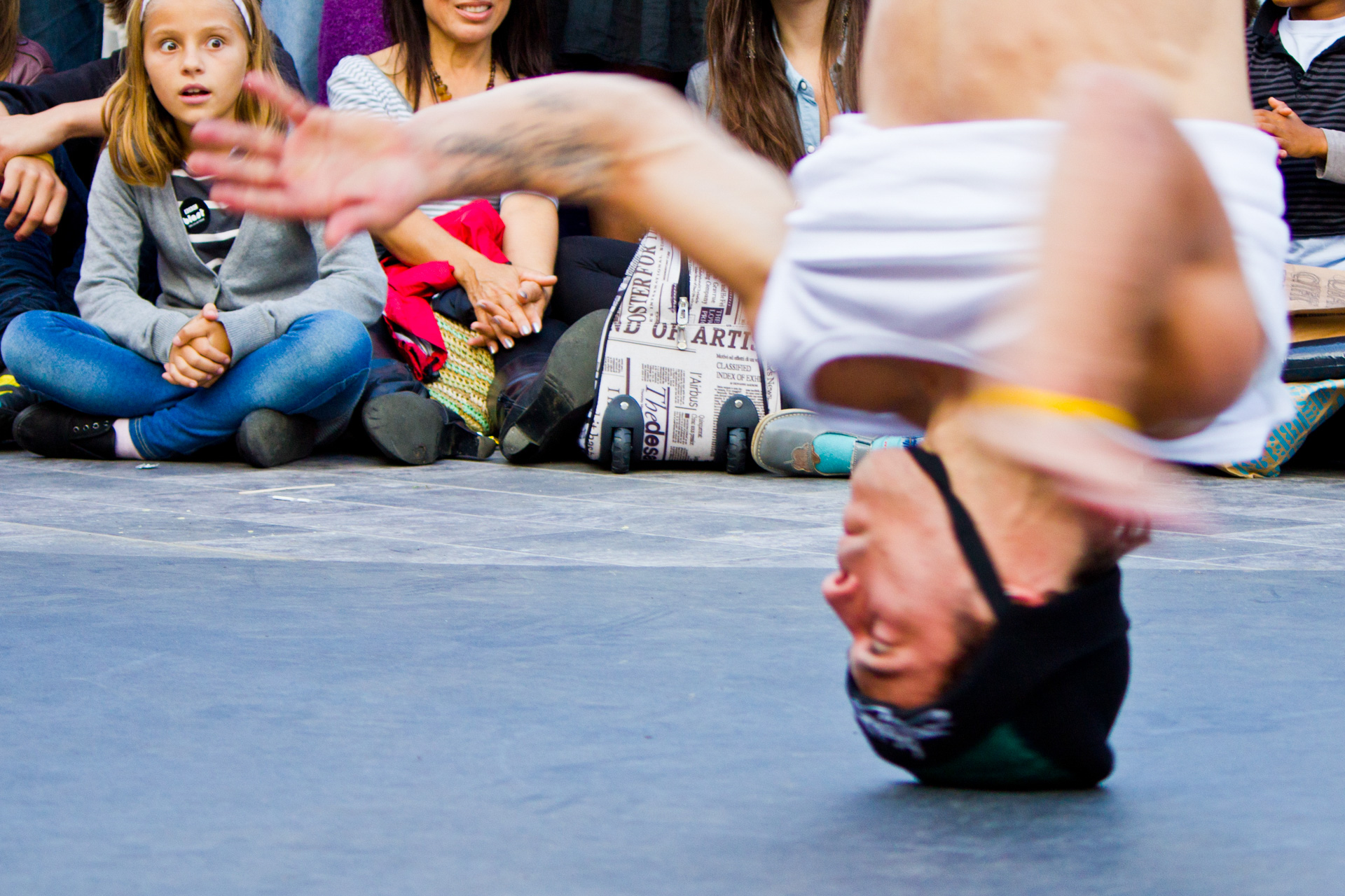 Person on their head captured with a slower shutter speed to conve movement
