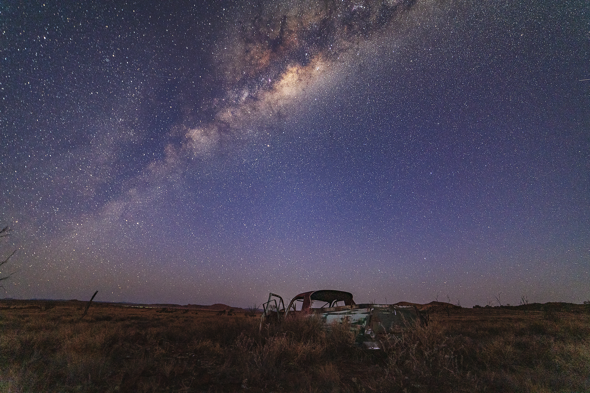 An abandoned old Ute under the Milky Way, remote Western Australia.