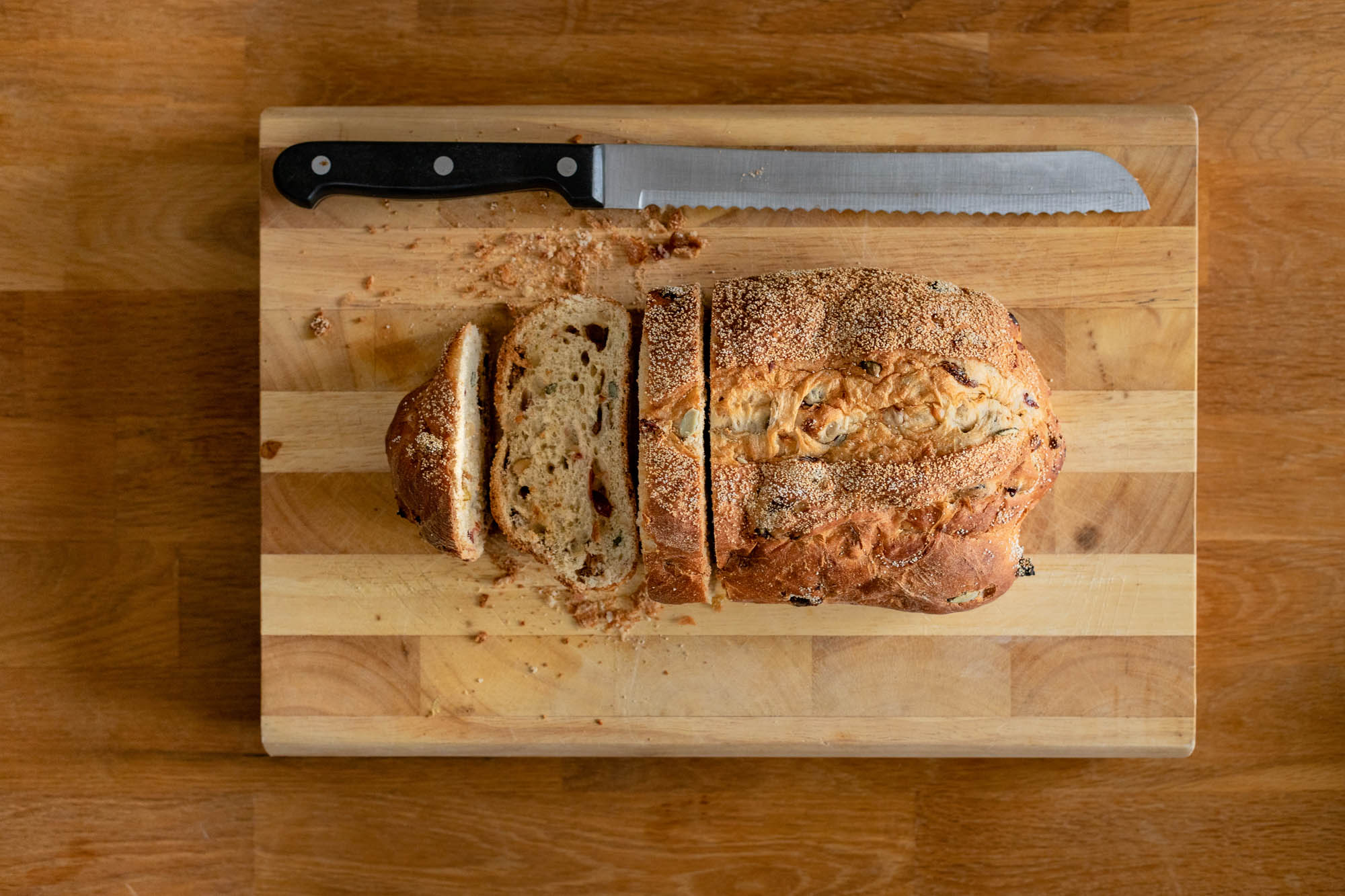 Overhead view of bread on a wooden chopping board