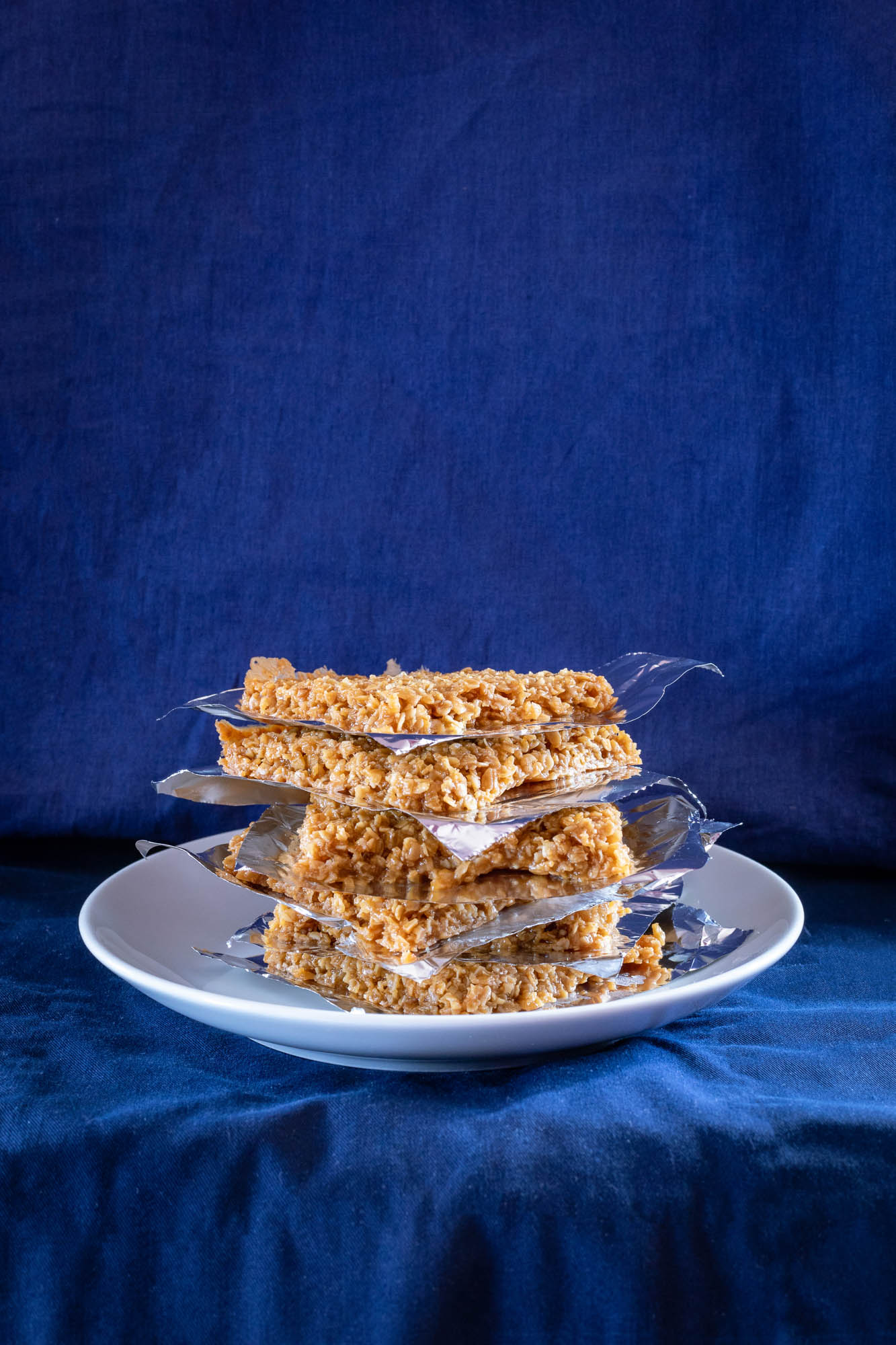 Flapjacks on a plate with a blue background