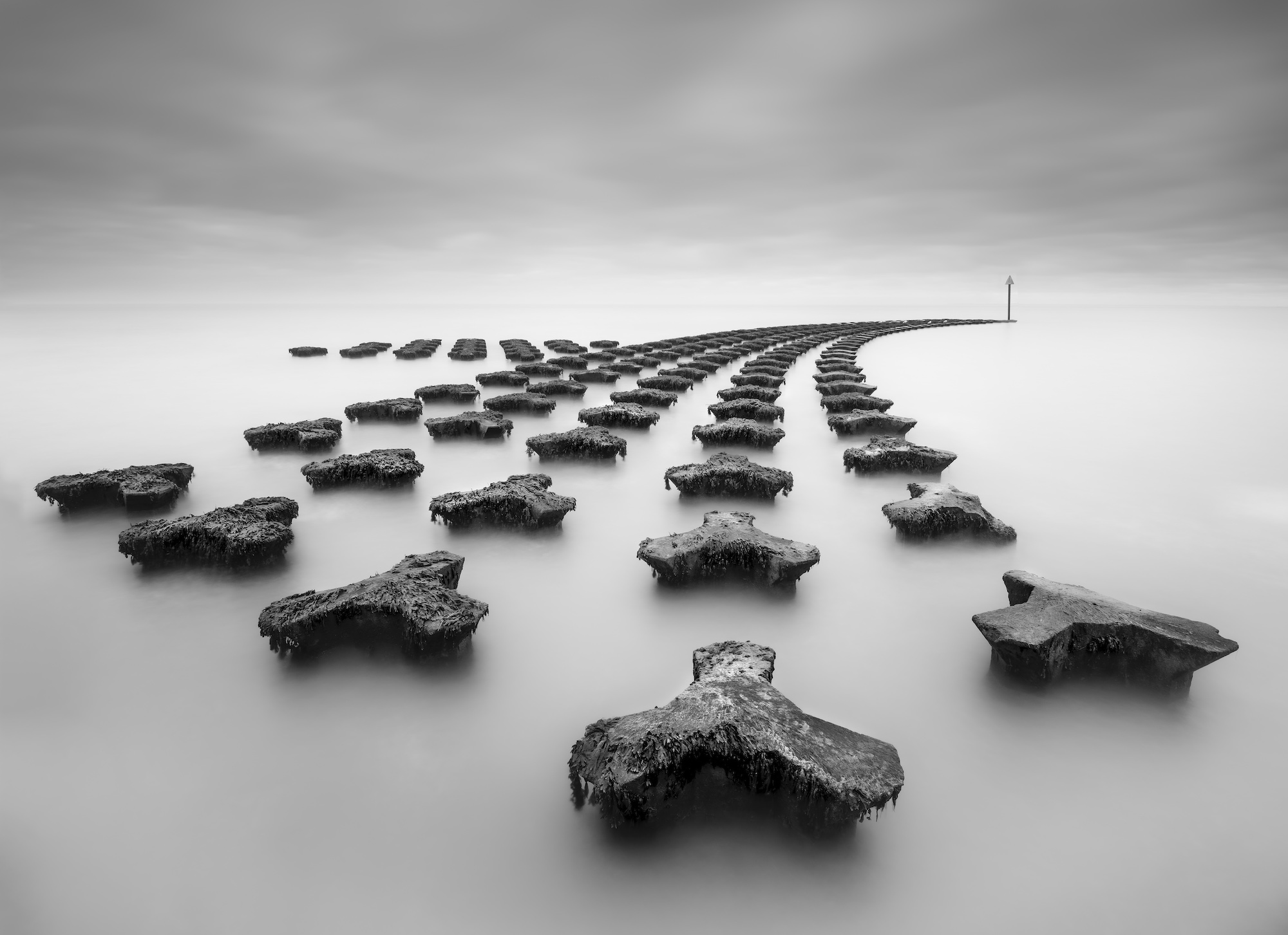 Long exposure image of the curved sea defenses at Felixstowe, England