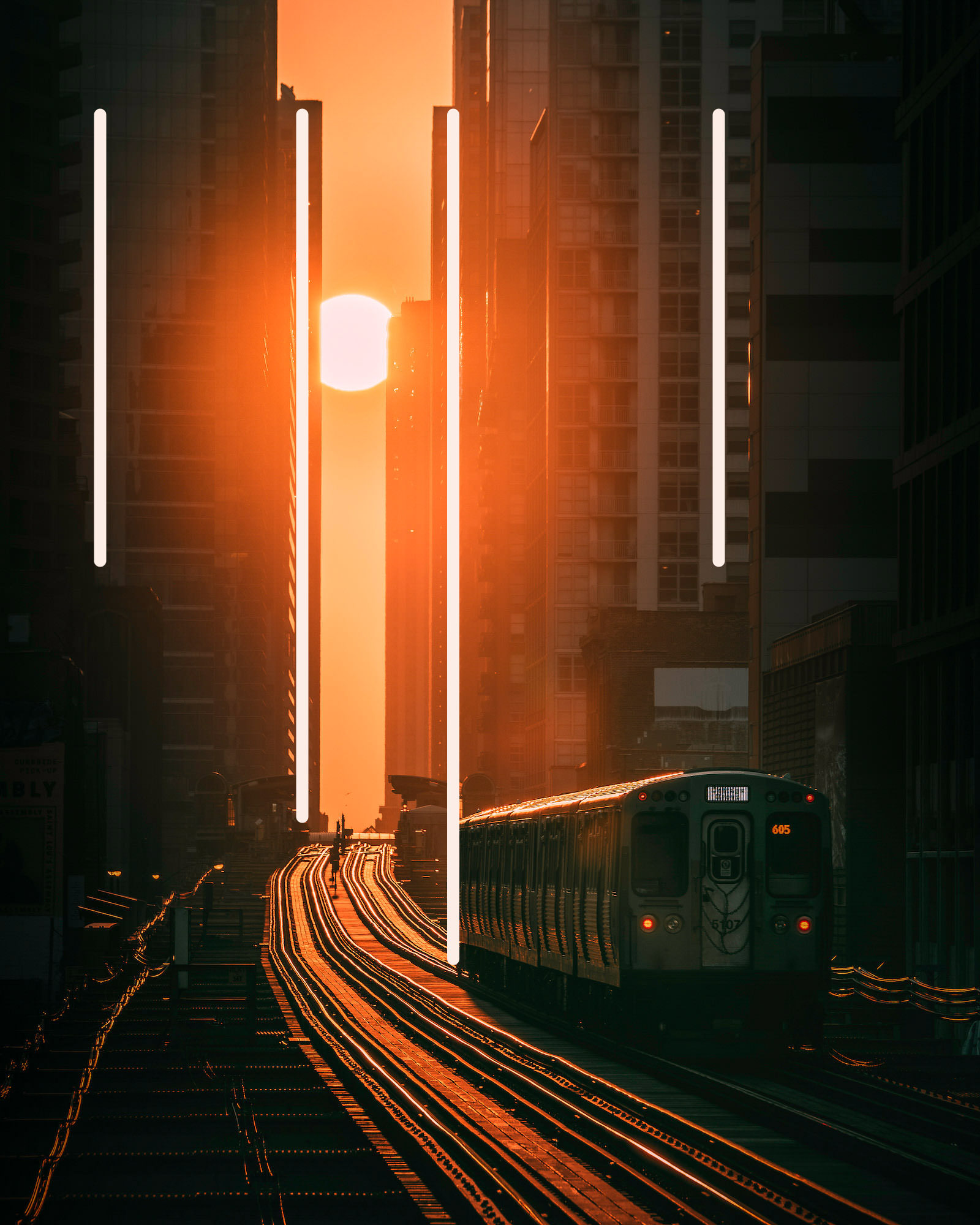 A train makes its way between towering buildings in the golden light of the sun, Chicago USA, with added leading lines to show the compositional technique