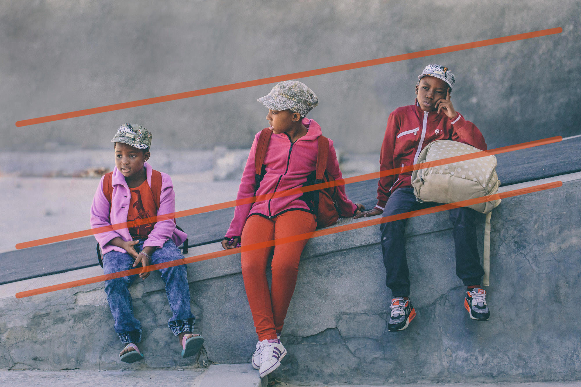 3 kids waiting in Cape Town, South Africa with added leading lines showing compositional techniqueo
