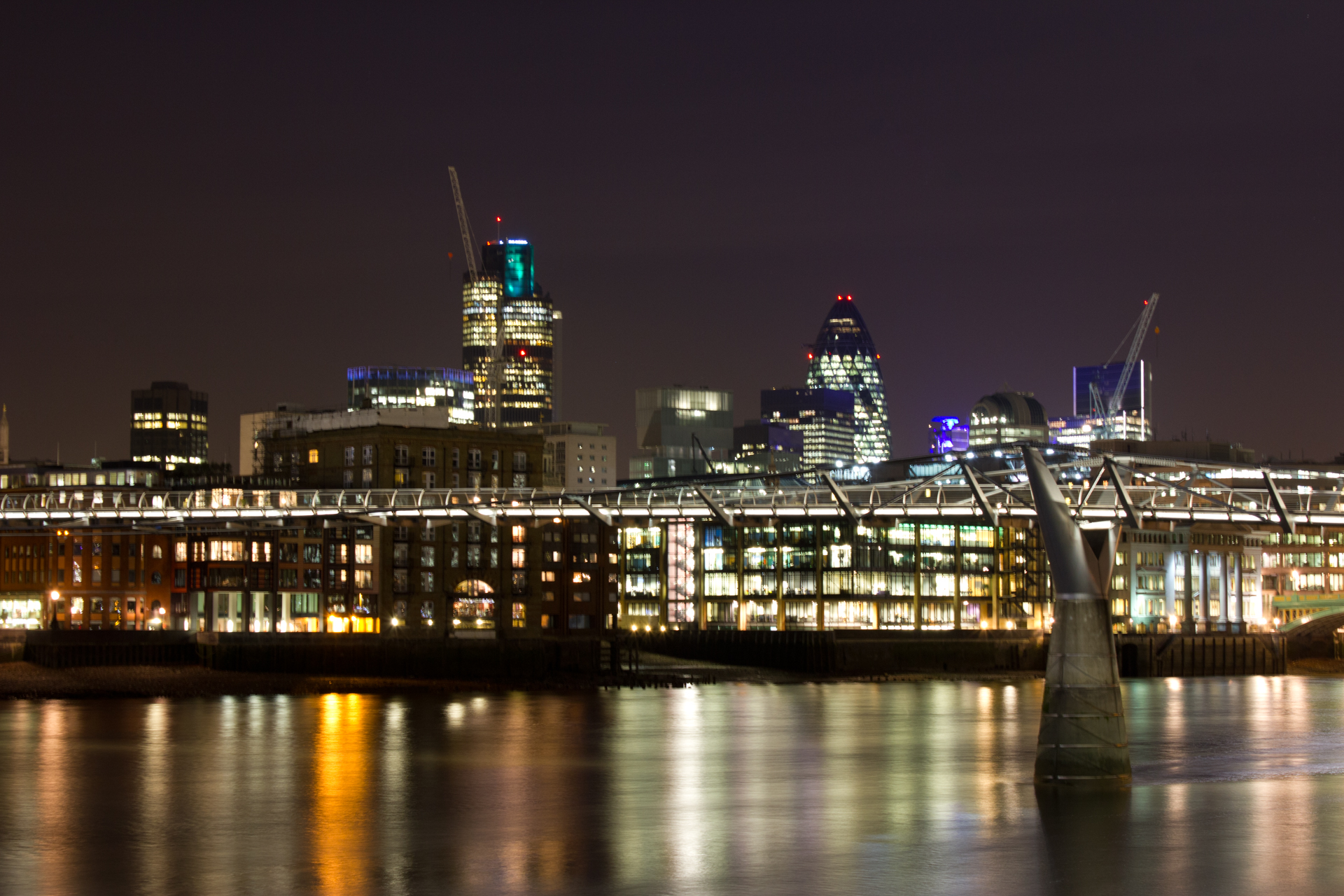 The London skyline at night blurred due to camera shake caused by pressing the shutter
