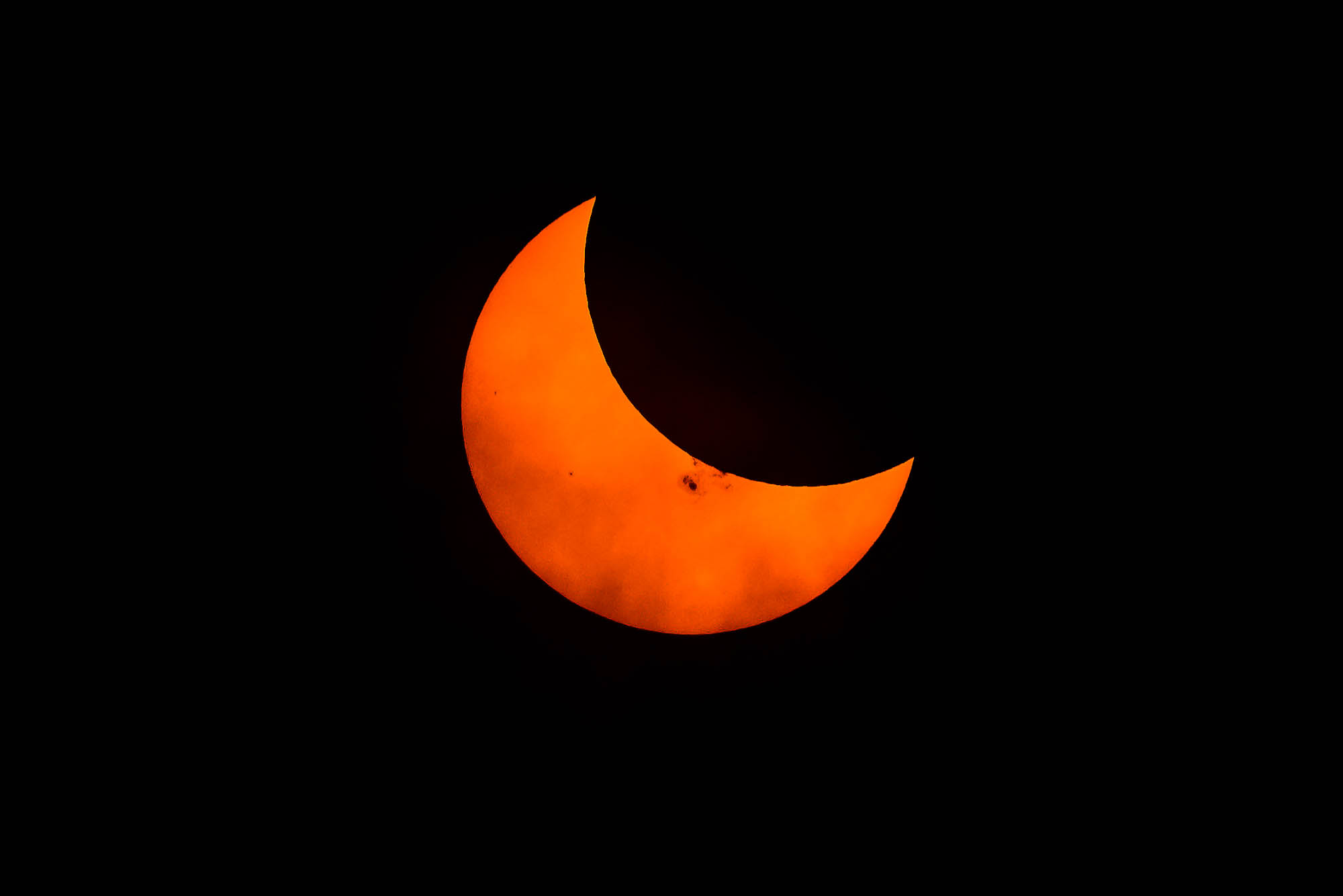 October 23, 2014 partial solar eclipse from Vancouver, Canada. Image shows large sunspot cluster.