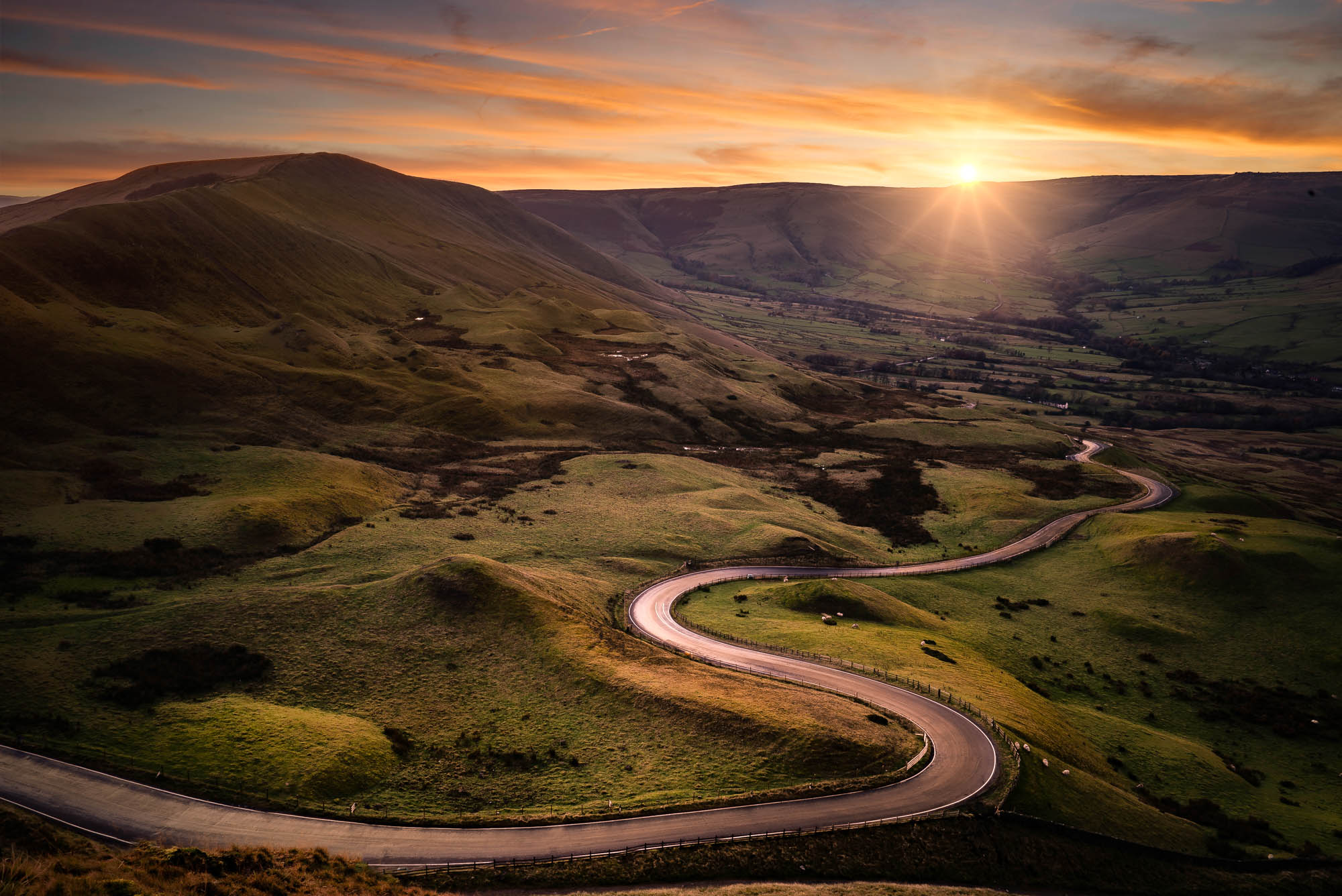 The road from Edale snakes its way up to Mam Tor in the glorious Derbyshire Peak District.