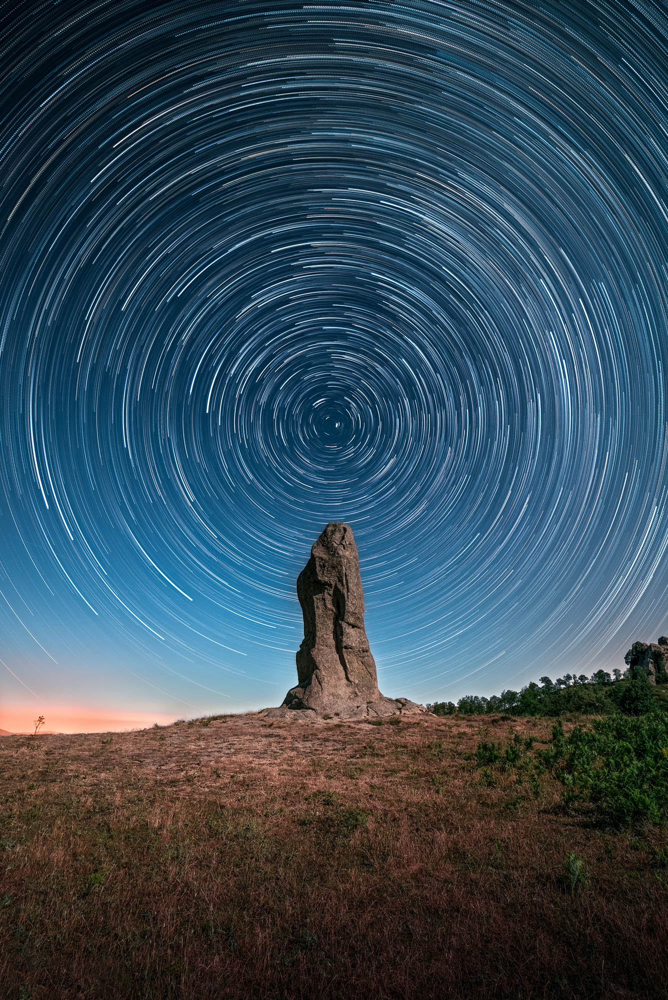 Startrail of 120 shots taken at the Argimusco megaliths, in the territory of Santa Domenica Vittoria, in Sicily.