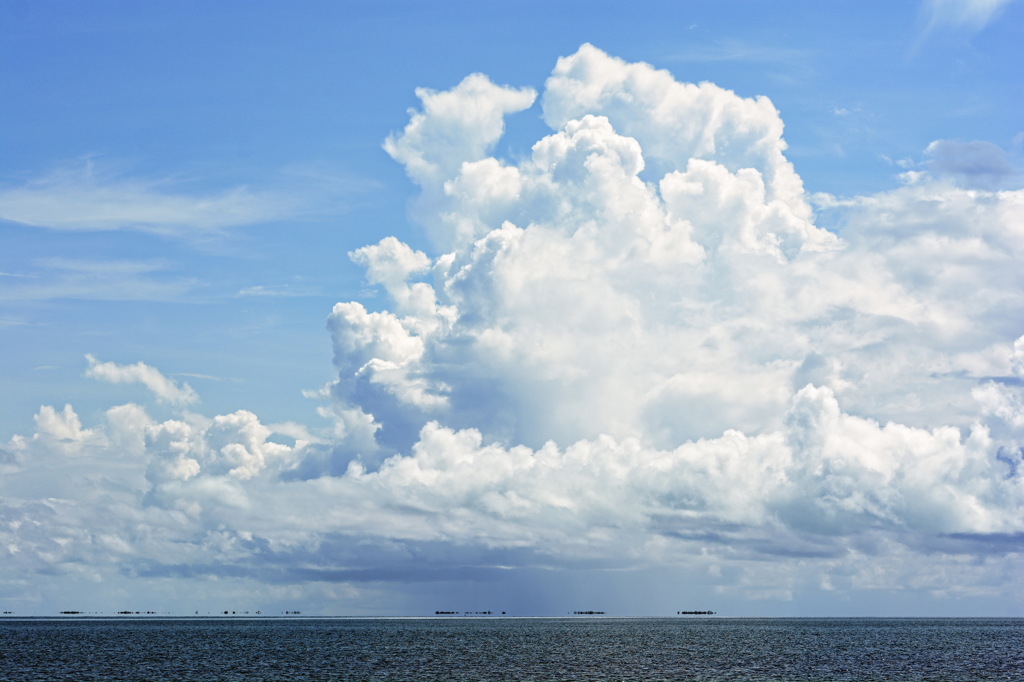 Big white clouds over the sea