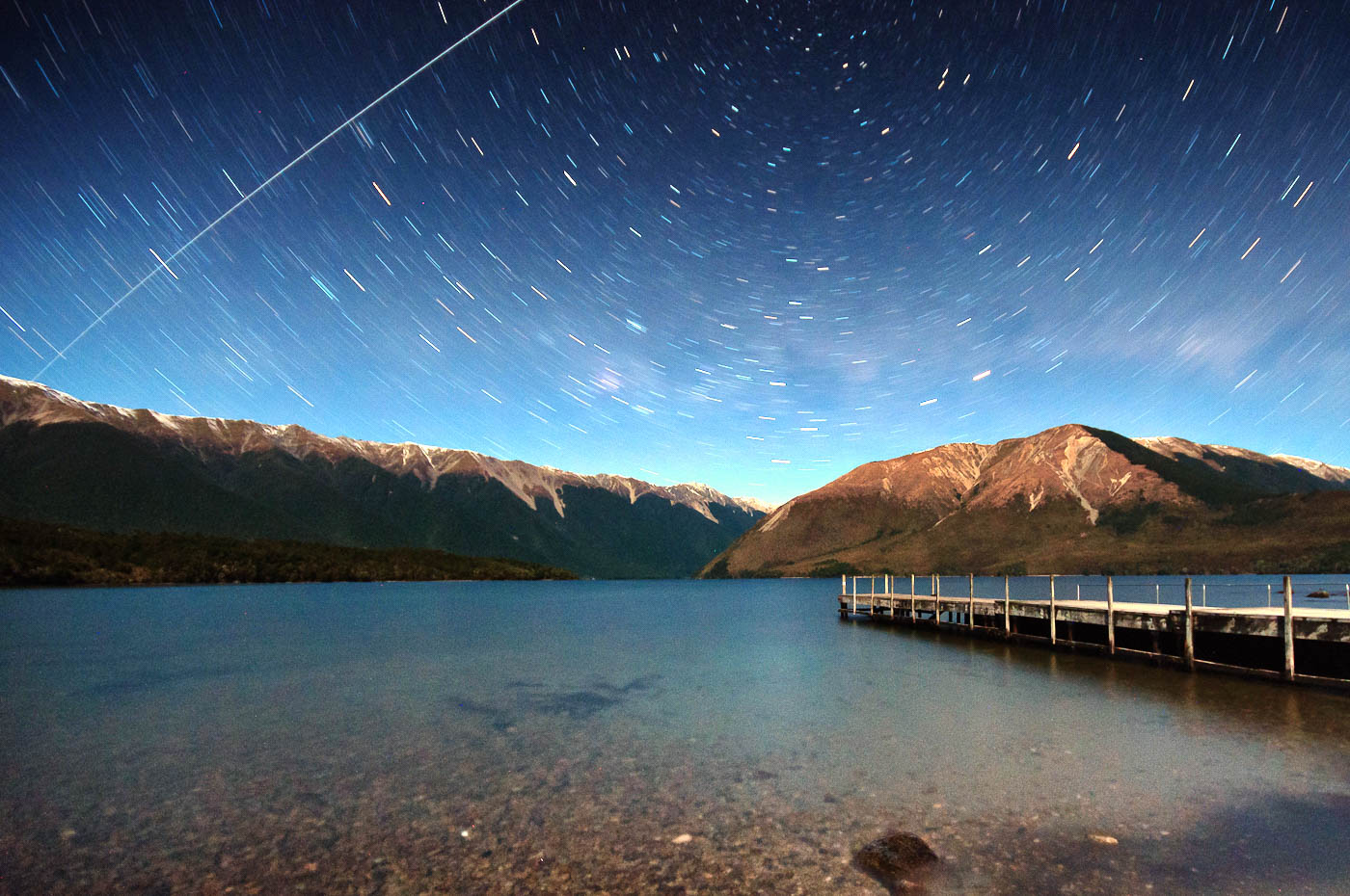 The International Space Station in a star trail over Lake Rotoiti, New Zealand.