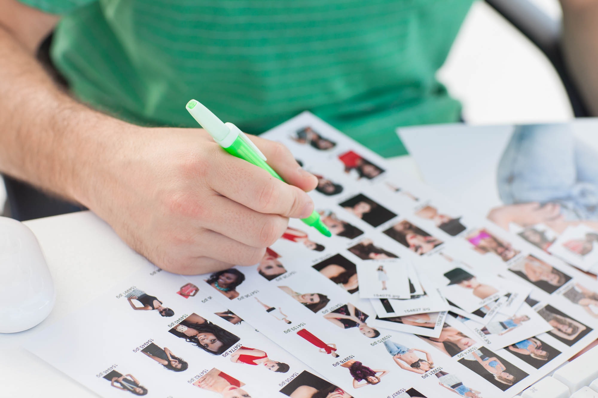 Photo editor looking through contact sheets