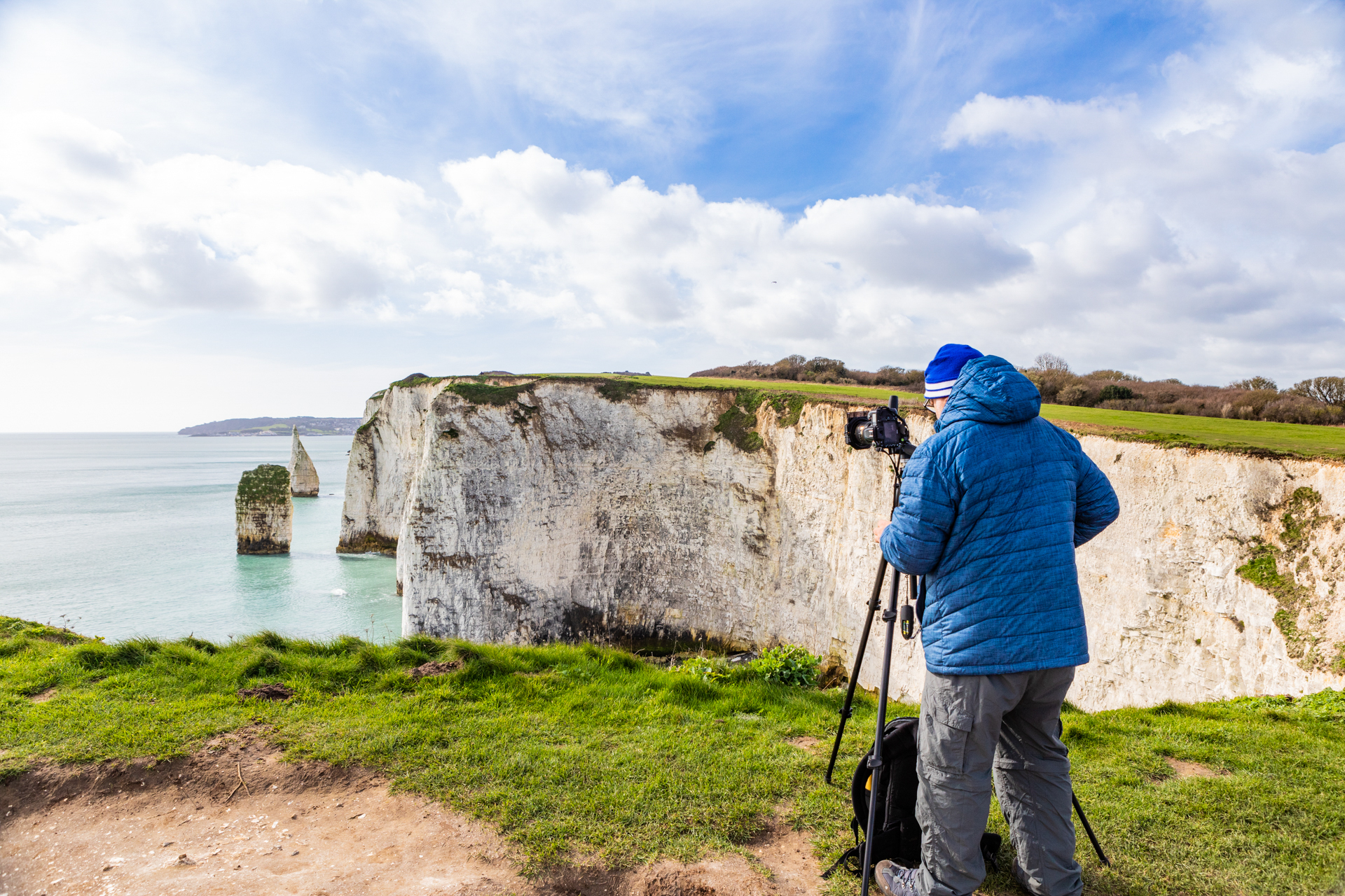 Photographer taking a seascape picture