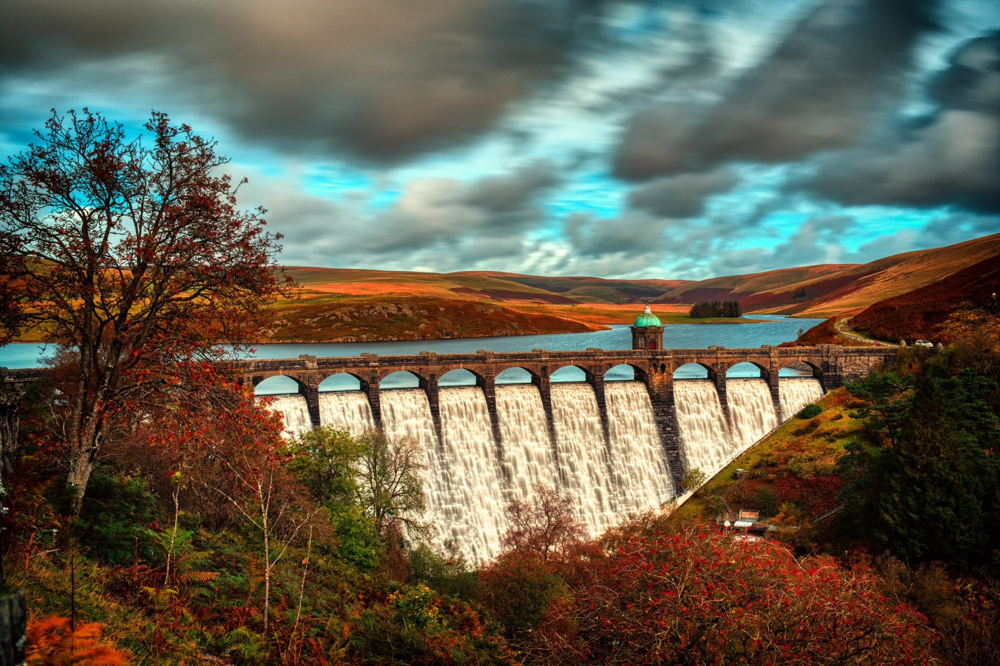 The overflowing Graig Goch dam in the Elan valley.