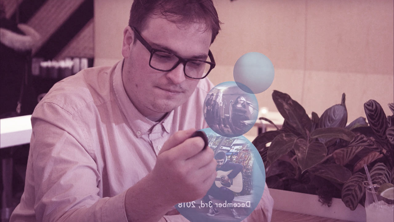 Person interacting with Heirlums in AR headset.