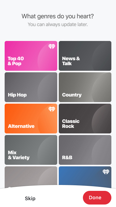 Genre picker screen with selected tiles saturated with color.