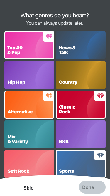 Genre picker screen with selected tiles with white frames on a dark gray background.