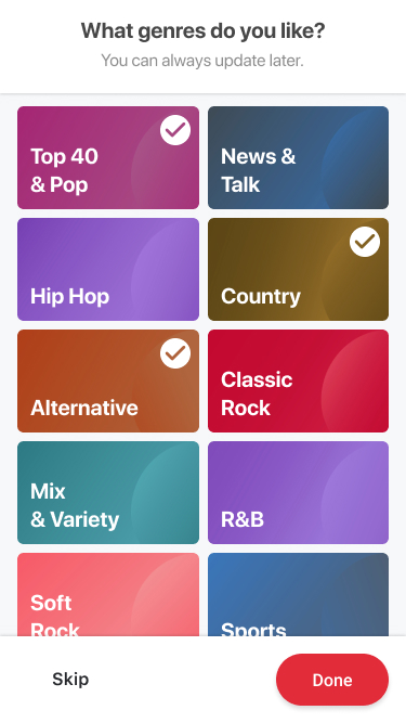 Genre picker screen with selected tiles indicated by a dark overlay and a check mark.