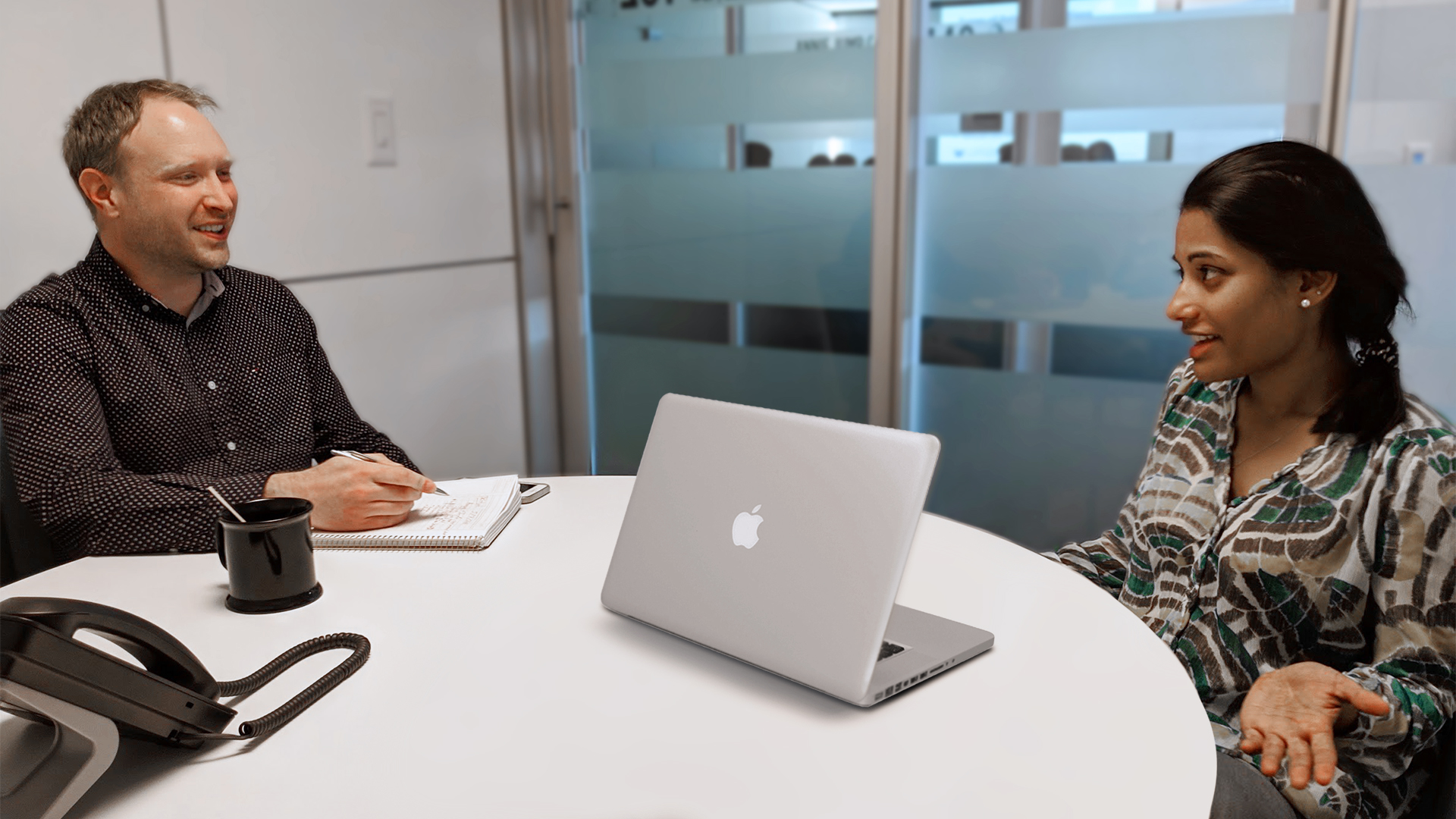 Researcher consulting with a CoMotion innovation manager.
