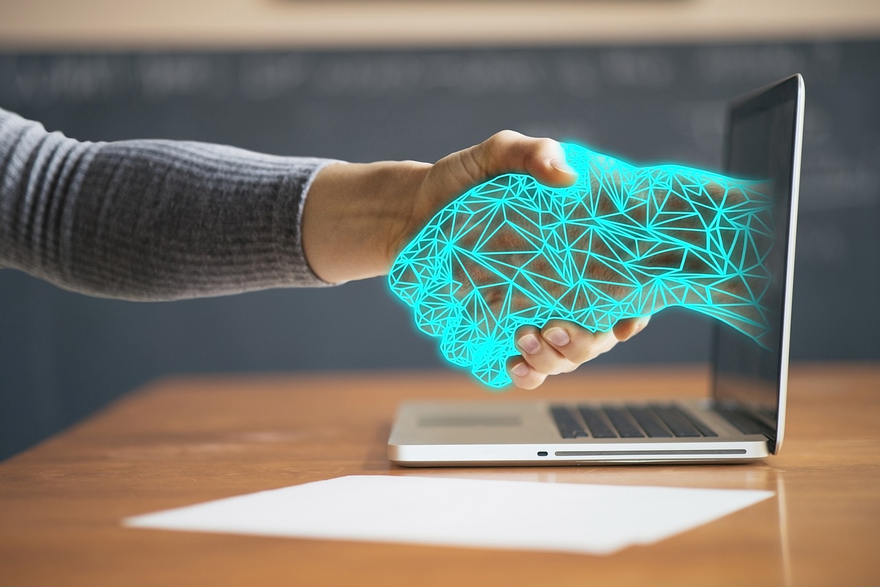 Customer Relationship - Handshake through computer
