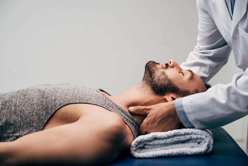 therapist giving treatment to the neck