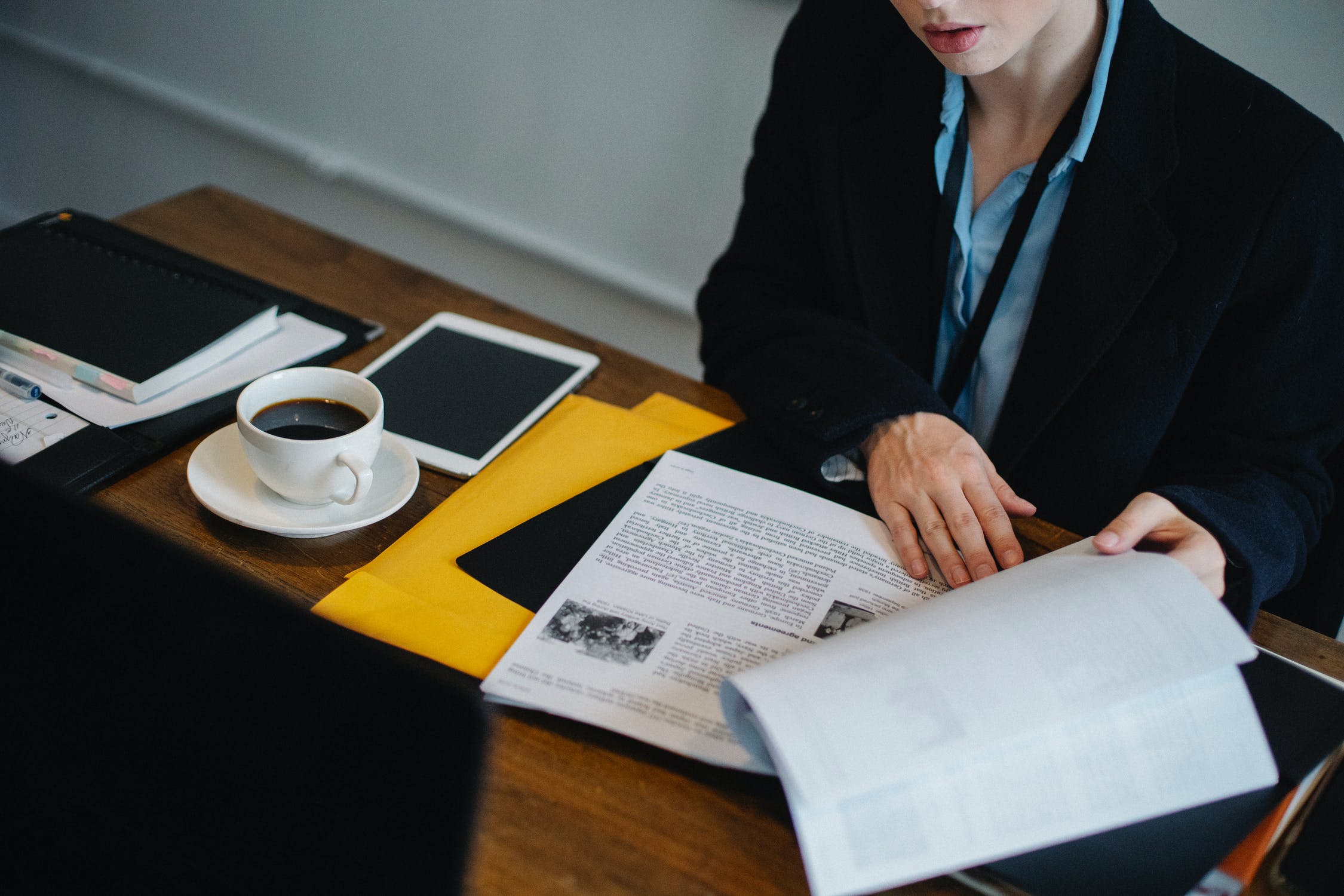Woman working with documents in a workspace
