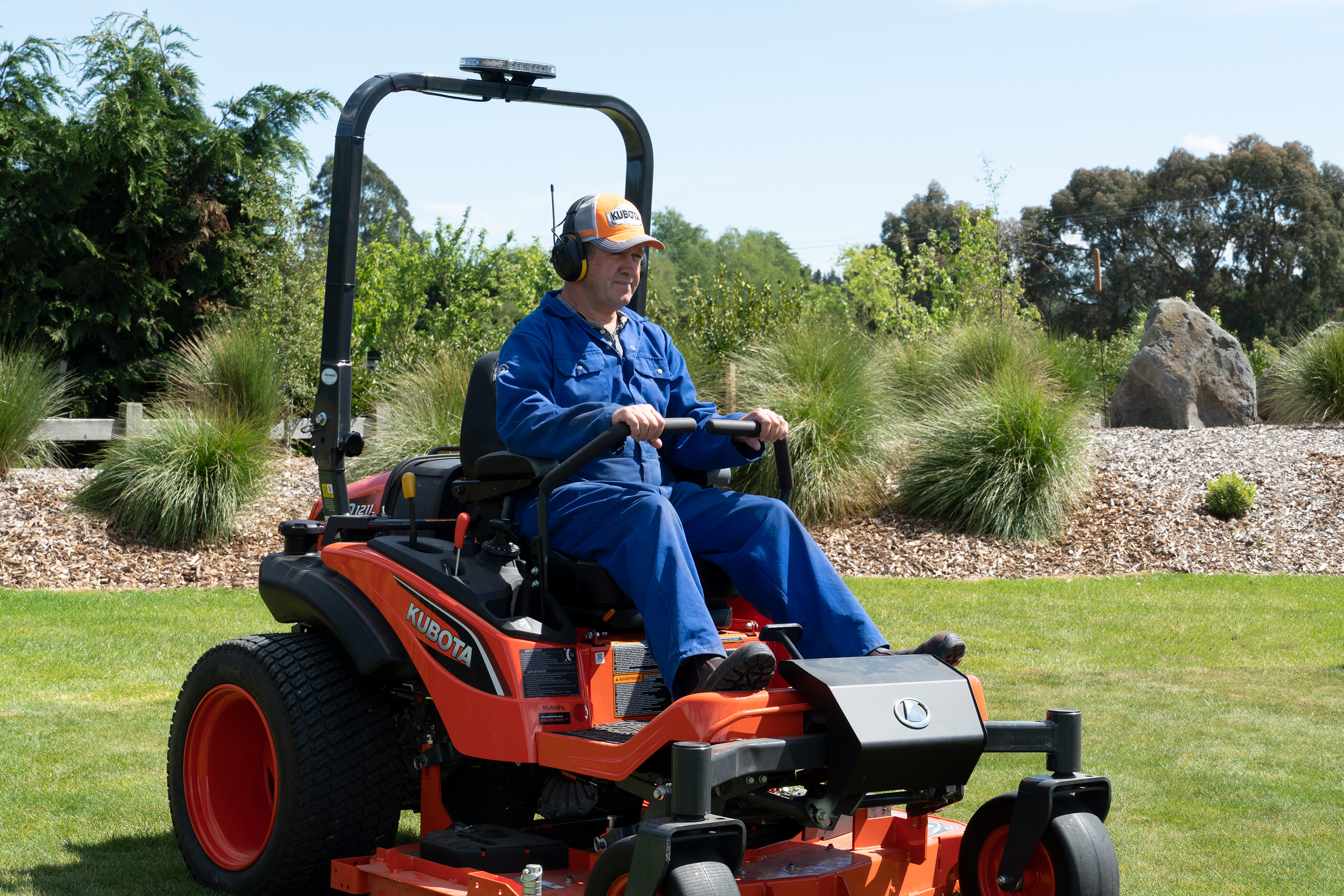 Murray Smith driving a lawn mower
